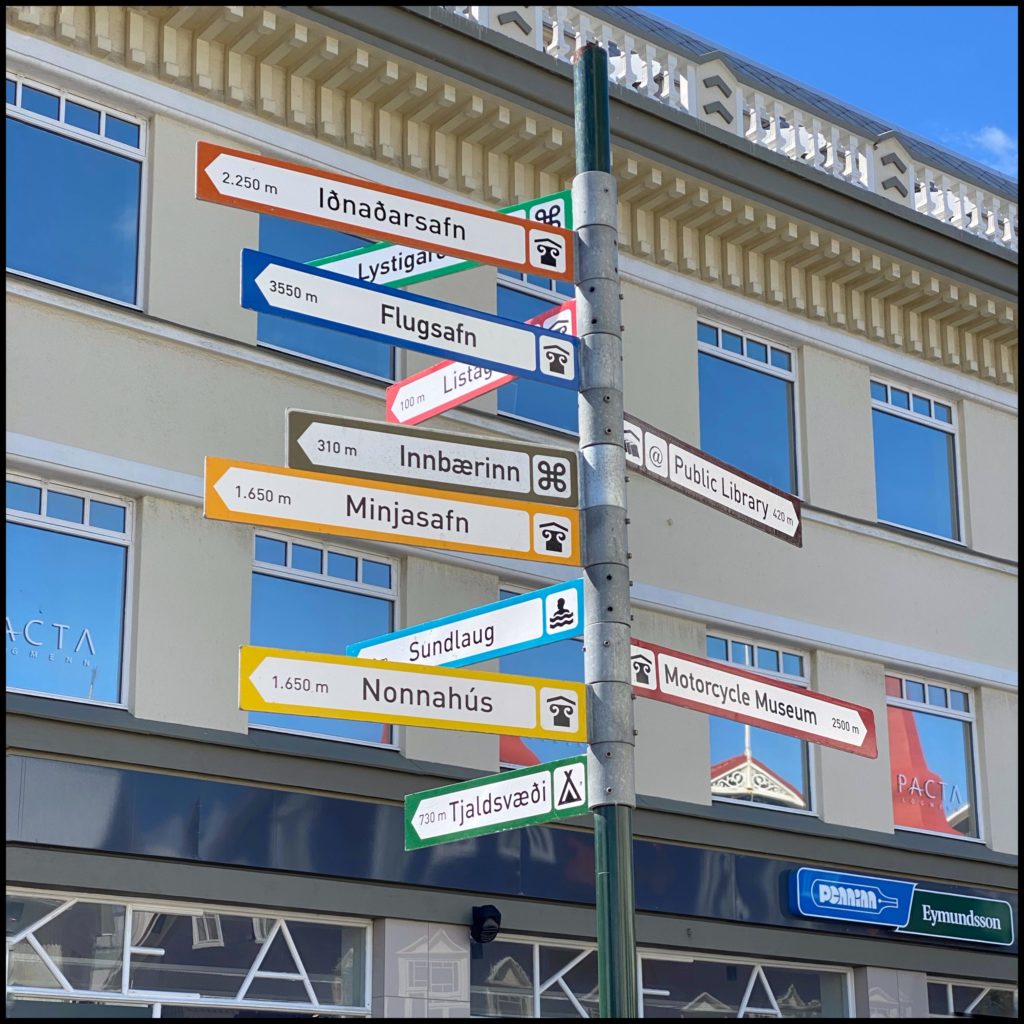 A Street Sign in Akureyri With many arrows