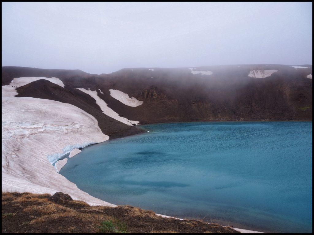 Lake with snow and clouds