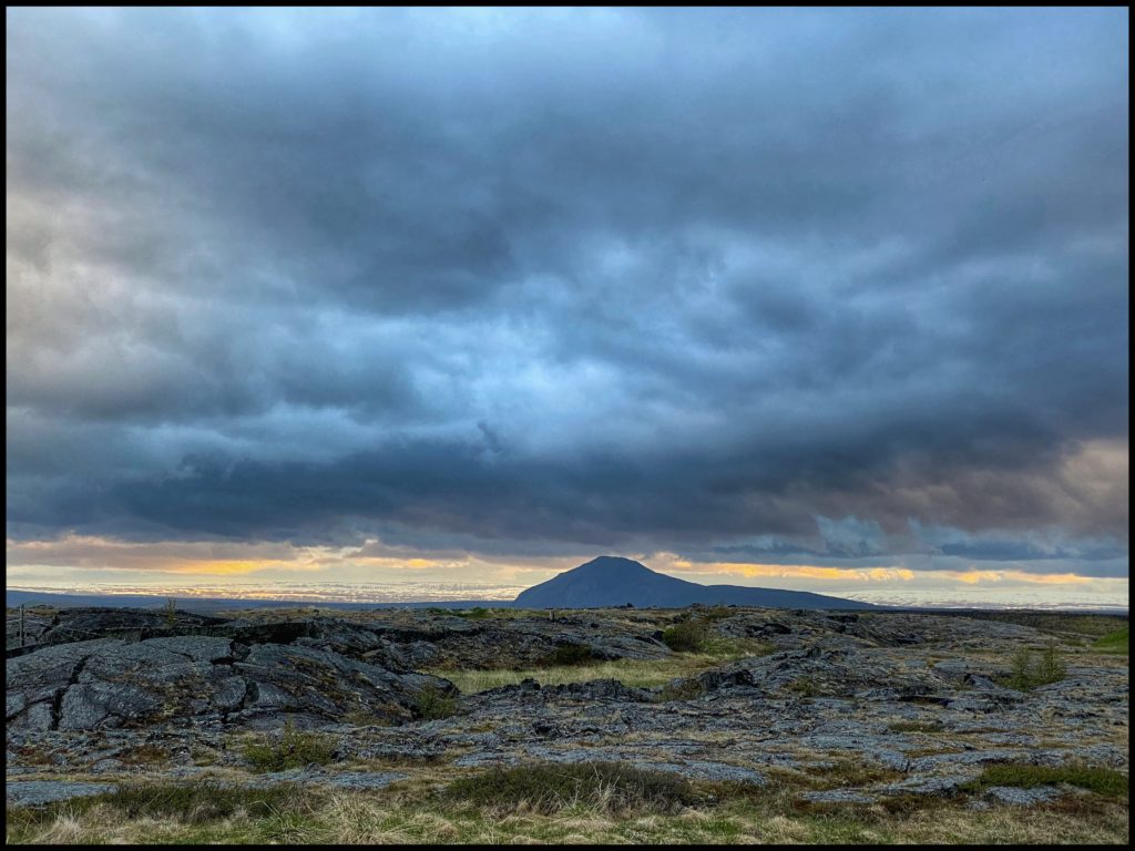 Sun setting over mountain